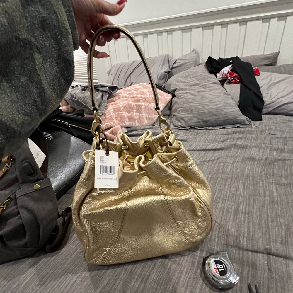 Cute gold bucket bag.